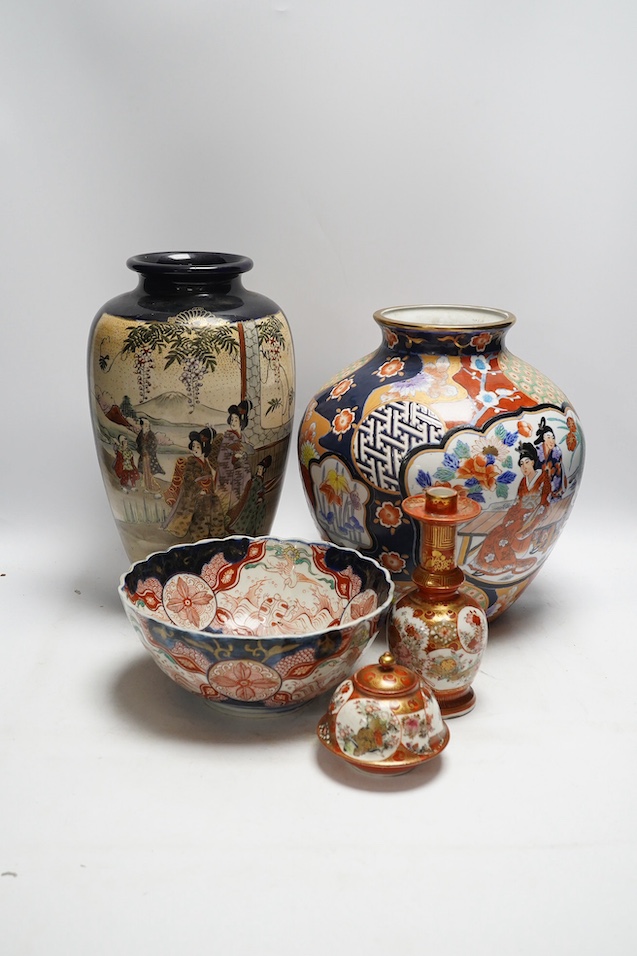 Japanese Kutani, Satsuma and Imari; four vases, a bowl, a pair of candlesticks and a pot (8). Condition - candle sticks damaged